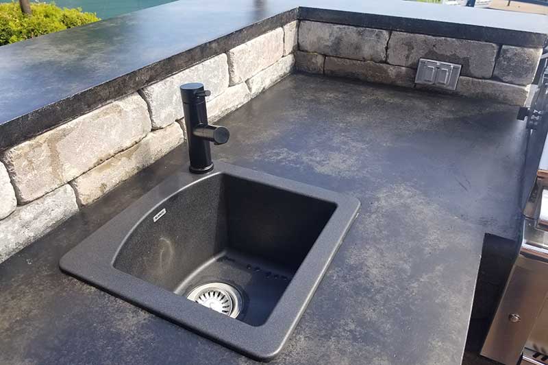 Custom concrete table top and granite sink